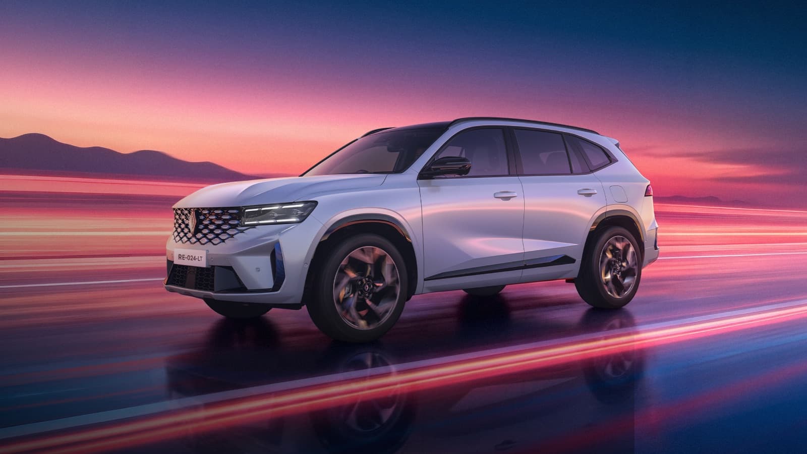 White Renault Koleos with a black roof travelling along a wet road at dusk, pink and blue light trails streaking past it